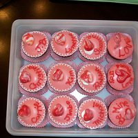 Valentine Cupcakes Strawberry cupcakes with cream filling, covered in fondant with chocolate heart accents and royal icing decoratinos