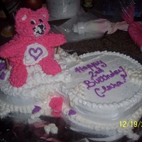 Pink Care Bear Care Bear is made out of rice krispy treats. "cloud" is 2 round cakes side by side. This cake isn't exactly how I hoped it...