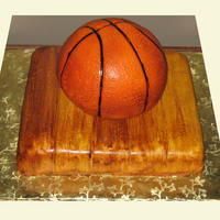 Basketball Cake Fondant covered basketball and floorboards for a groom's cake