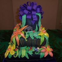 Jungle Themed This was my daughter's baby shower cake. It was made with yellow cake and rasberry and lemon curd filling covered in fondant.