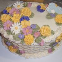 Wilton Course 2 Whoa! I had a lot of flowers to work with! Maybe too many for this cake. First time doing basket weave and making royal icing flowers and...