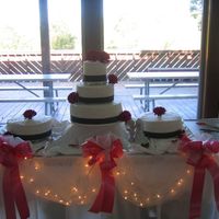 Gerbera Daisy Wedding Cake Buttercream, polka dot ribbon with fresh fuschia gerbera daisies.