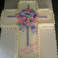 Jess Communion chocolate 12 X18 " carved to cross- filled w/ strawberry Bc. Covered in bc with gumpaste pearls,bow,roses