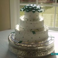 My First Fondant Bow 3 tier cake with lemon poppyseed, coconut, and white chocolate layers with champagne filling. Handmade fondant beading, and my first...