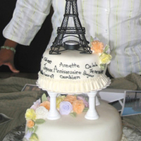 Summer In Paris Cake for winner of a trip to Paris. Fondant covered two-layer filled cakes with pastel fondant roses topped with a metal Eiffel Tower;...