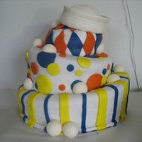 Navy Topsy Turvy First topsy turvy cake, made for a going away party for a close friend. Gumpaste/fondant cover on top, white chocolate golf balls around...