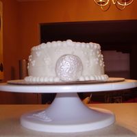 Practice Fondant Cake Practice cake using Michelle Foster's fondant. It still needs a little work. Thanks for looking.