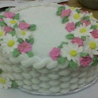 Basketweavejpg_Cropped.jpg First attempt at basketweave. This is from Wilton Course 2. The flowers are royal icing daisies and apple blossoms.