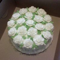 19_Buttercream_Roses_2.jpg Buttercream Wilton roses. This cake has 19 buttercream roses on top with a rope border on the bottom.