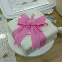 Fondant_Bow.jpg This was my first attempt at fondant, it is one of the cakes in Wilton Course 3. It is a strawberry cake with cheesecake filling.
