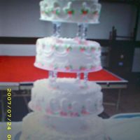 Cake_1_.jpg This is a cake I made for a baptism, it's all buttercream with royal icing apple blossoms