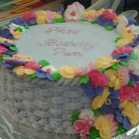 C7.jpg My co-wrokers birthday cake, all the flowers are royal icing, strawberry with strawberry bstawberry ffruit filling