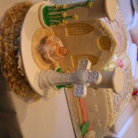 My Daughter Baptism Cake The cake topper is made out of fondant and sugarpaste. The baby in a shell is a ceramic cake topper purchased at a local store. The cake...