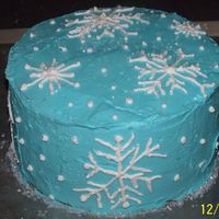 Snowflake Cake Buttercream frosting, cake sparkle sprinkled on top.