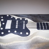 Guitar Cake Guitar cake for my son. Just choc. cake with buttercream. I started to put silver sparkles on the gray part and then decided it wasn't...