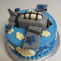 Airplane Cake For a friend..she said some type of old looking war plane...The cake was carrot with Decorator's Cream Cheese. Plane is RKT covered in...