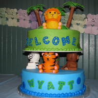 Jungle Animal Shower Cake This is my version of the Wilton Safari Cake for my cousin's baby shower. Buttercream with fondant animals and accents. Trees are...