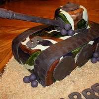 Garret's Army Tank Cake This was my son's Army Tank birthday cake to go with his camo theme birthday party. It was actually really fun to make. Covered in MMF...