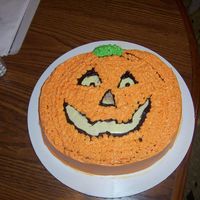 Pumpkin This is my first cake EVER! Orange cake with buttercream frosting. chocolate outline. Mom watched but I made it all from start to finish.