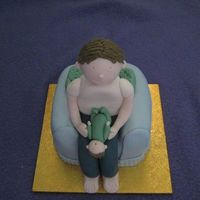 First Fathers Day The figures are gumpaste, the chair is made of marsbar slice coveredin fondant. It was my DH first fathers day & our son likes to lay...