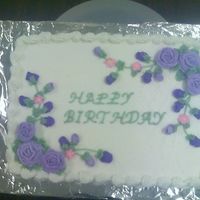 Wilton Class Cake Wilton class buttercream frosting with Royal frosting roses and rosebuds.