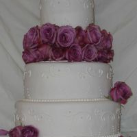 Purple Rose This is a cake I did for my moms birthday as practice. The top tier is pumpkin chocolate chip with chocolate ganache filing. the two bottom...