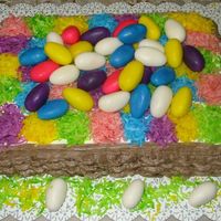 Basketweave Easter Basket This is my first attempt at basketweave. Coconut filled yellow cake covered with buttercreme and tinted coconut and marshmellow eggs.