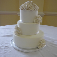 White On White All white cake. Bottom is Almond Joy Explosion, middle and top vanilla bean with white chocolate ganache. GP roses