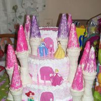 Autumn's Castle Cake 12", 10", and 6" Iced and decorated in BC. Columns are covered in melted white chocolate and then sprinkles. I made this for...