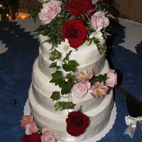 Fondant Wedding Cake Rolled fondant. One tier had chocolate with raspberry filling, another lemon cake with lemon pudding filling and the third was white cake...