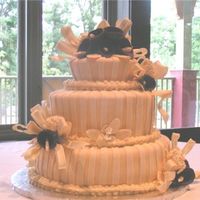 First Calla Lily Cake This was the first carved wedding cake I ever did. I did it about two years ago, and it was also my first try at gumpaste calla lillies....