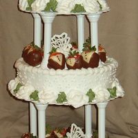 First Wedding Cake I made this Cake for a friend's wedding. The top is chocolate middle white and the bottom is cheesecake.