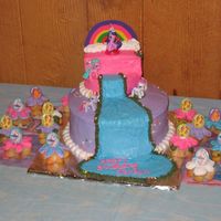 My Little Pony Cake The bottom layer is chocolate, the top layer is butter cake. The cupcakes are white cake with sprinkles. I used all buttercream to frost...