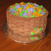 Basket Full Of Pansies? This is an oval cake made for a friend's b-day. It is a yellow cake with chocolate buttercream icing. It is decorated with basket-...