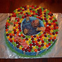 Swimming Pool Cake I made this for my husband for his pool party. The center is piping gel. The tiles are skittles.