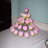 Wilton Babyshower Cupcakes This is the Wilton babyshower cupcakes on the Wilton large cupcake stand. The babies were made out of MMF.