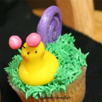 Garden Cupcake - Snail butter yellow cupcake w/ buttercream frosting in a mix of Willow Green & Kelly Green. Satin Ice snail on top.Inspired by absolutecakes...