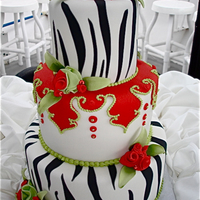 Valentine's Cake Thank you for viewing our cake. This cake was done for a very special lady who was turning 50 years old. This was a fun challenge as one of...