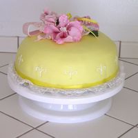 Yellow Cake With Gumpaste Flowers Just a white cake covered in yellow marshmallow fondant. The flowers were my first try at gumpaste and they were a disaster. I tried to...