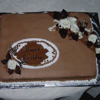 Cake For Mother This is a chocolate sheet cake with chocolate buttercream icing. The roses are molded from candy clay.