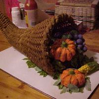 Horn Of Plenty chocolate cake with buttercream frosting, royal icing basket, ding-dong with buttercream pumpkins, chocolate cake with buttercream corn,...