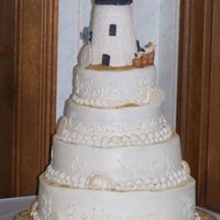 Lighthouse Retirement Lighthouse and base are gumpaste and fondant over styro. Seashells are mmf dusted with gold and pearl luster dusts. The lighthouse "...