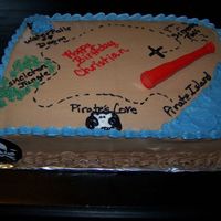 Treasure Map chocolate buttercream icing w/ toy accents