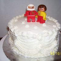 Practice Wedding Cake This is my first try at a wedding cake. I didn't have a bride and groom but my boys had legos. so... here you go..