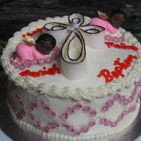 Baptism Cake Both babies are edible. and cross is made out of Fondant.