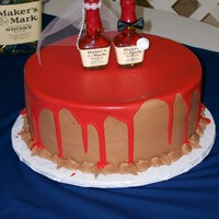 Maker's Mark Groom Cake Iced in chocolate BC icing with red ganche poured over top!