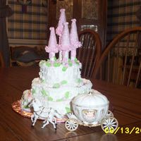 Princess Castle for dh's co-workers daughters birthday...marble cakes, sugar cones on top of hollow dowels rolled in edible glitter. Hope she likes it...