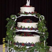 Wedding Cake-Emily & Raul bottom Italian Cream cake, med-brides white cake, top chocolate-surrounded with strawberries, blueberries and raspberries.