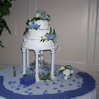 Kim's Wedding Cake Brides white-real flowers on top, sides and fountain silk-with baby's breath and ferns.