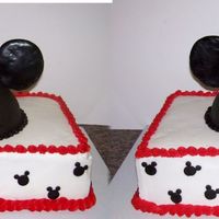 Mickey Mouse Cake Front and back pictures of Mickey Mouse cake. The hat is 1/2 ball pan and the ears are sugar cookies.